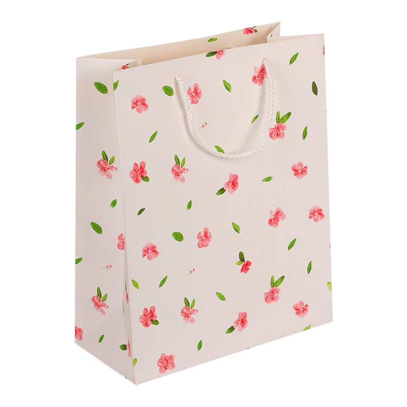 Geschenktüte aus Papier mit Blumenmuster und Griff