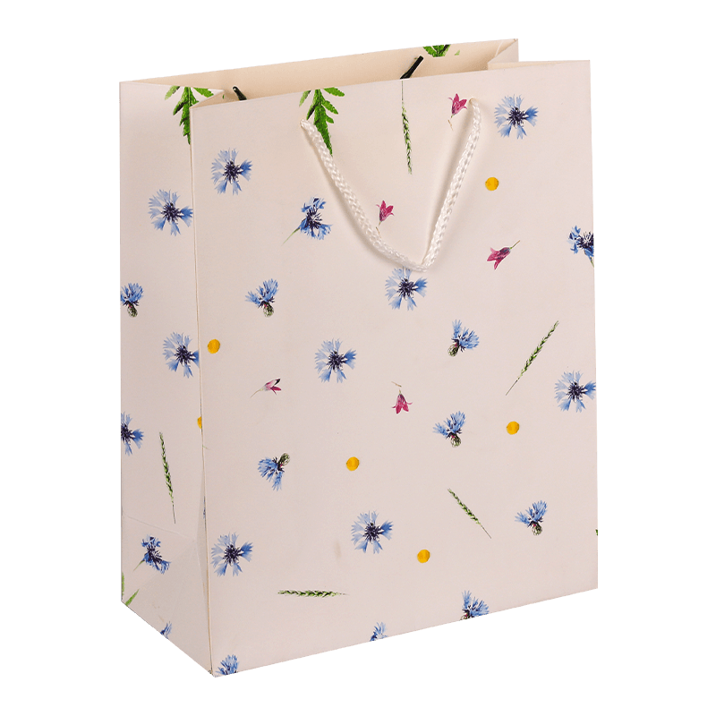 Geschenktüte aus Papier mit Blumenmuster und Griff